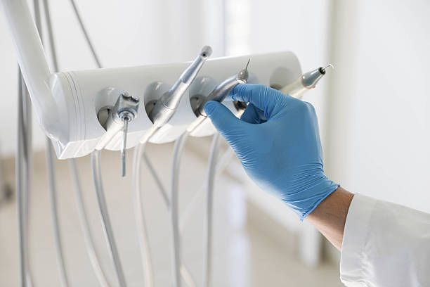 Professional Tooth Extraction technician working in Wellsville, KS